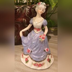 Elegant Porcelain Figurine with Floral Accents, 8 Inches Approx.
